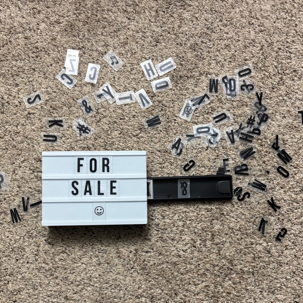 Sign with Black Letters